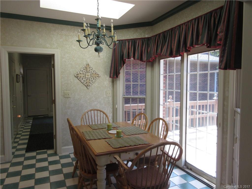 6235 Miller Road Kannapolis, NC 28081 - Photo 14 of 24 a view of a dining room with furniture and chandelier