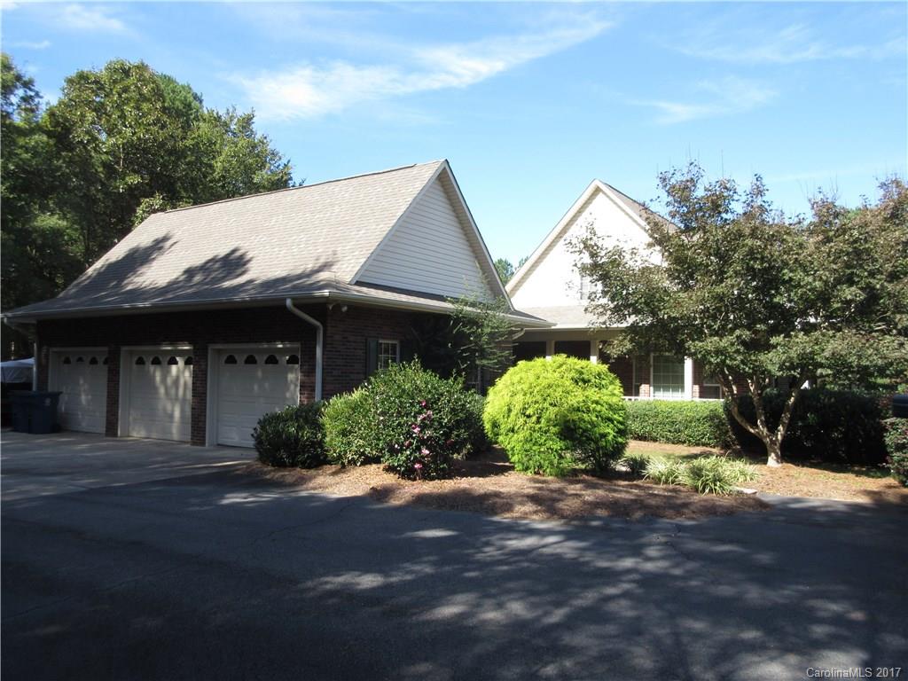 6235 Miller Road Kannapolis, NC 28081 - Photo 3 of 24 a front view of a house with a yard and garage