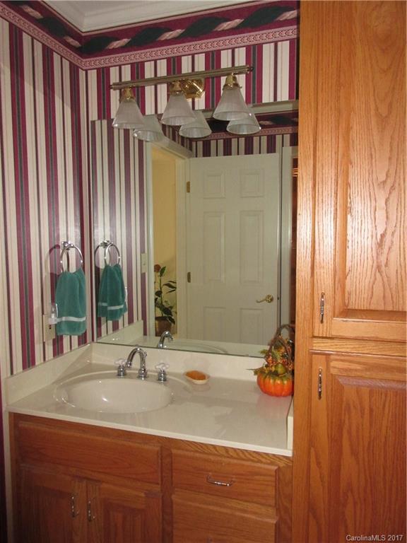 6235 Miller Road Kannapolis, NC 28081 - Photo 22 of 24 a bathroom with a sink and a mirror