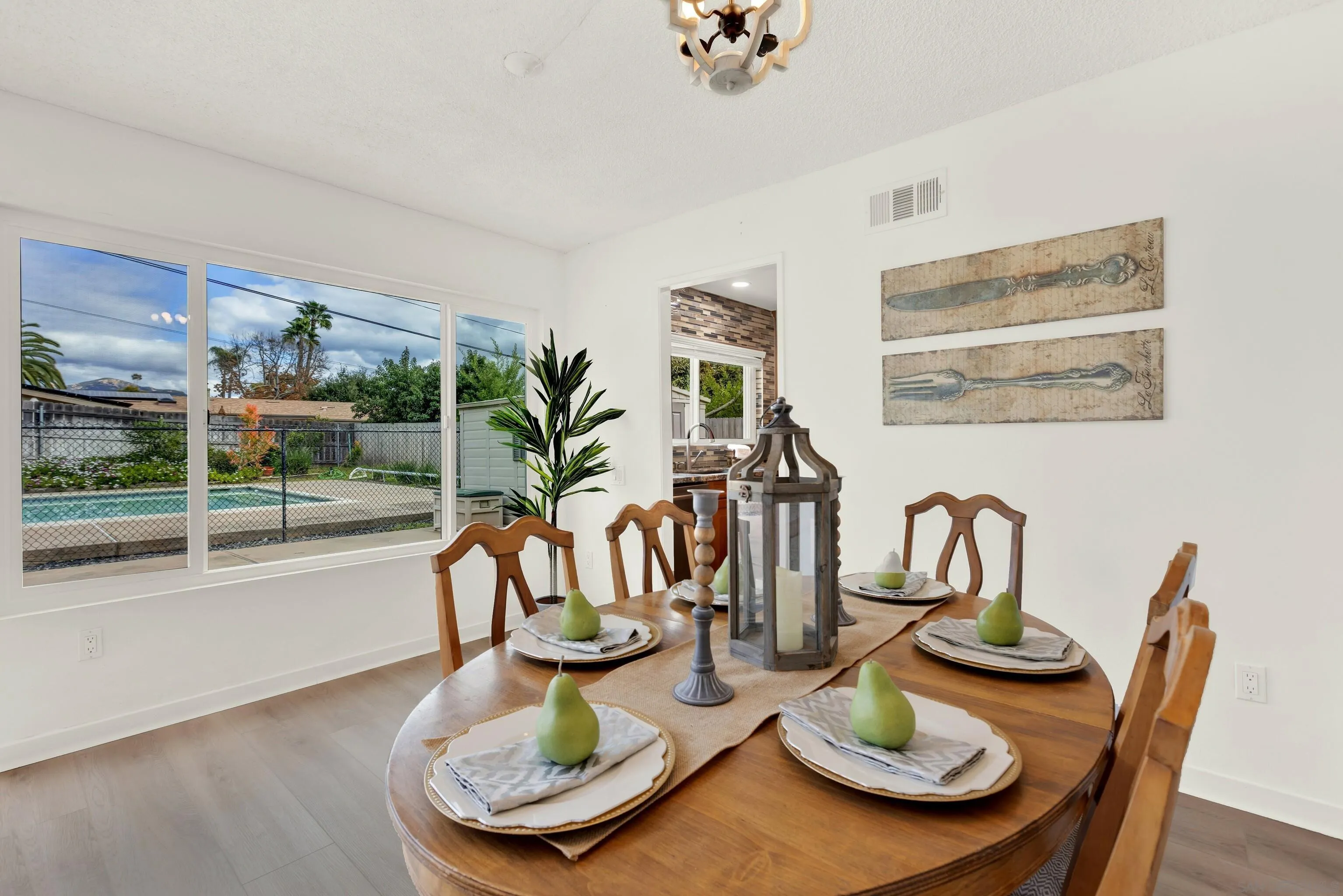 14545 Hillndale Way Poway, CA 92064 - Photo 15 of 52 a dining room with furniture a glass table and chairs