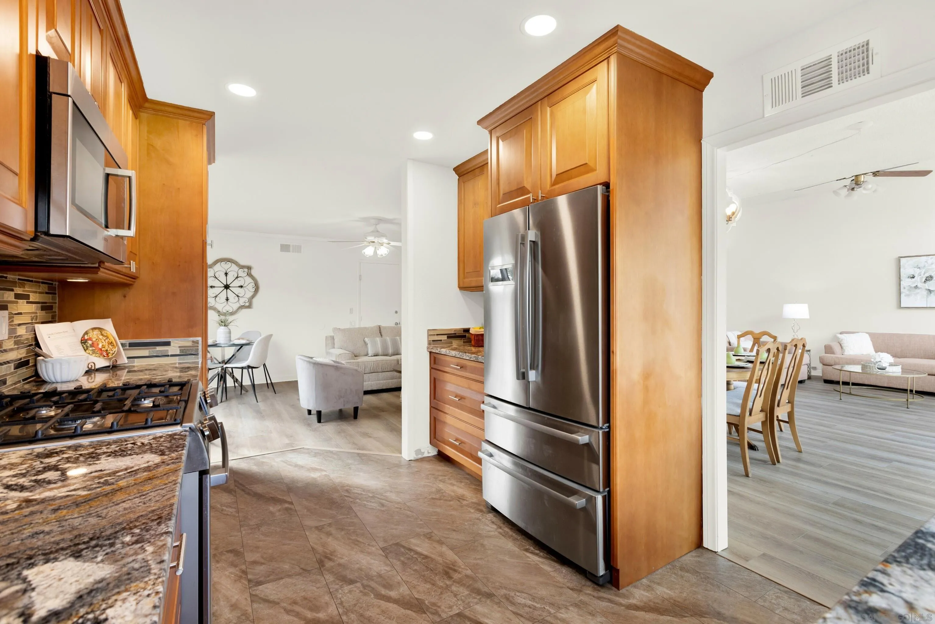 14545 Hillndale Way Poway, CA 92064 - Photo 16 of 52 a kitchen with stainless steel appliances a refrigerator and a stove