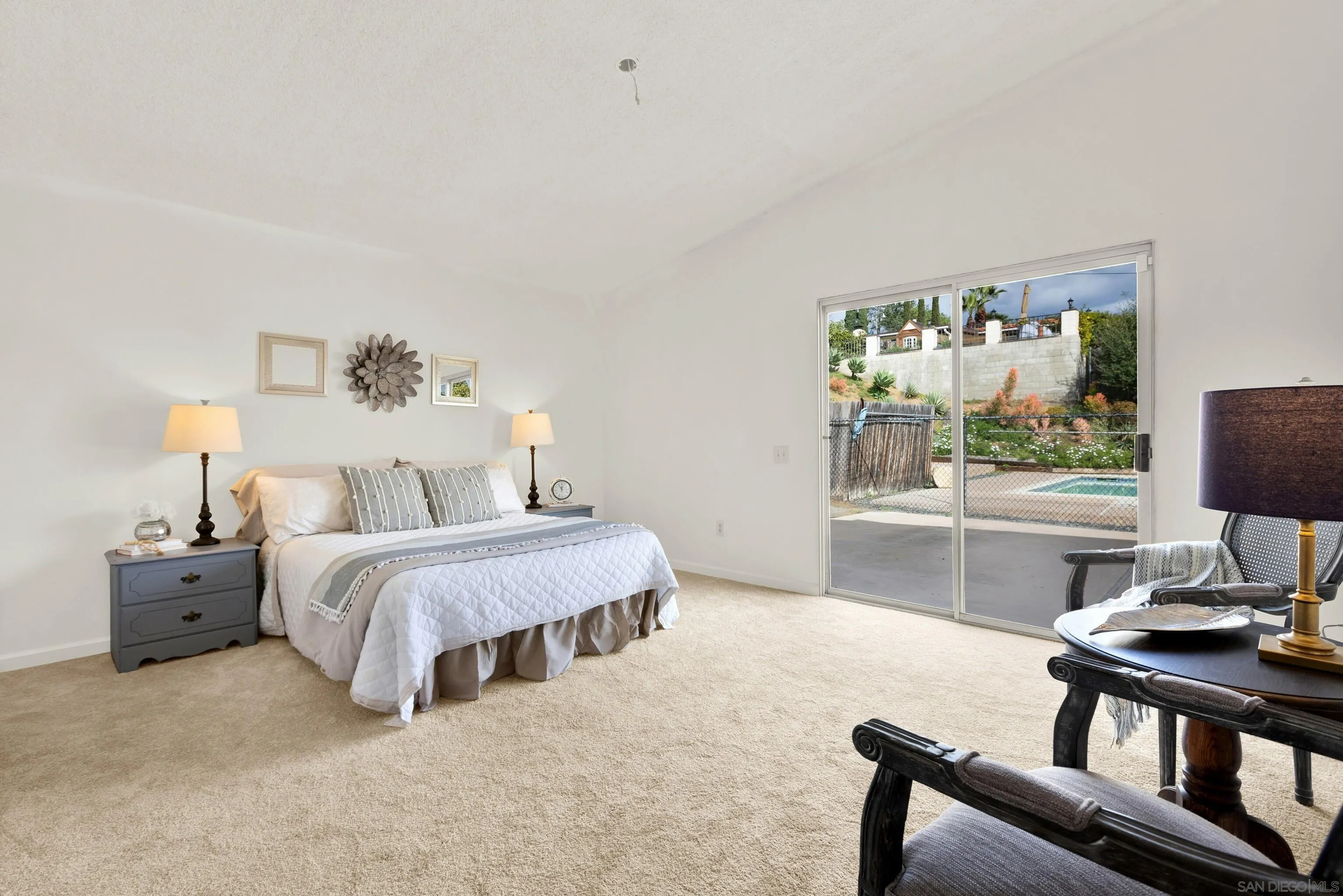 14545 Hillndale Way Poway, CA 92064 - Photo 26 of 52 a spacious bedroom with a bed and large window