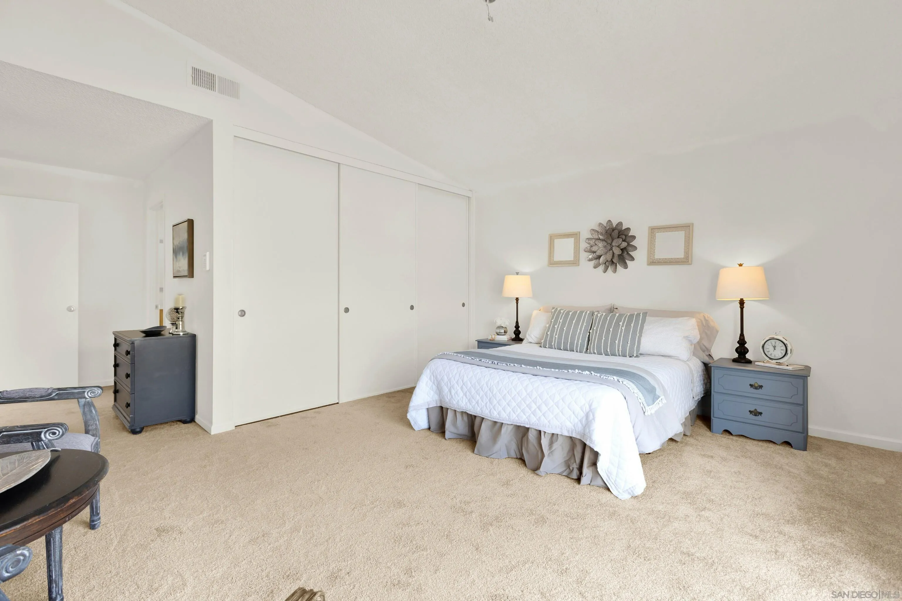 14545 Hillndale Way Poway, CA 92064 - Photo 27 of 52 a bedroom with a bed and lamp