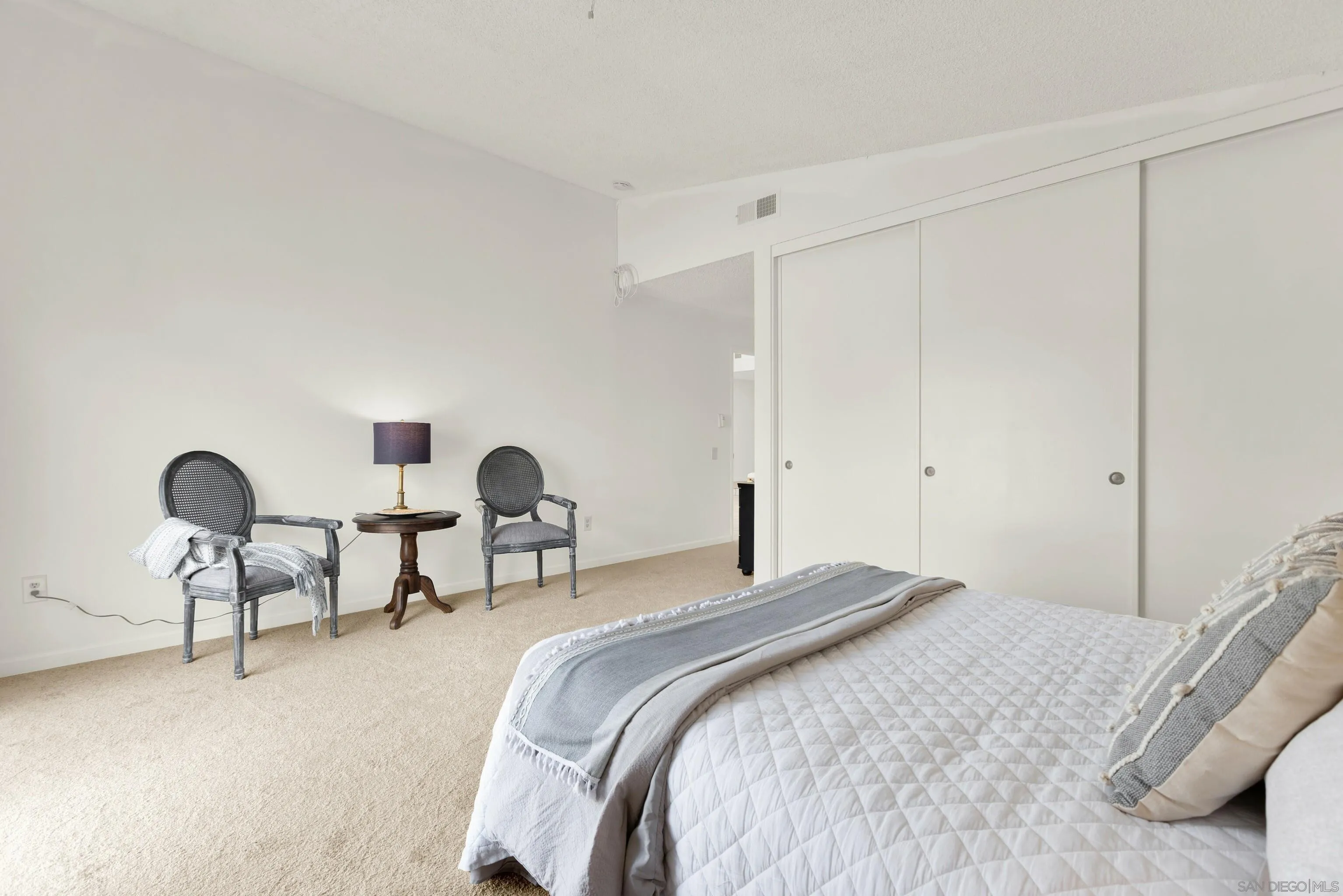 14545 Hillndale Way Poway, CA 92064 - Photo 28 of 52 a bedroom with a bed and a chair