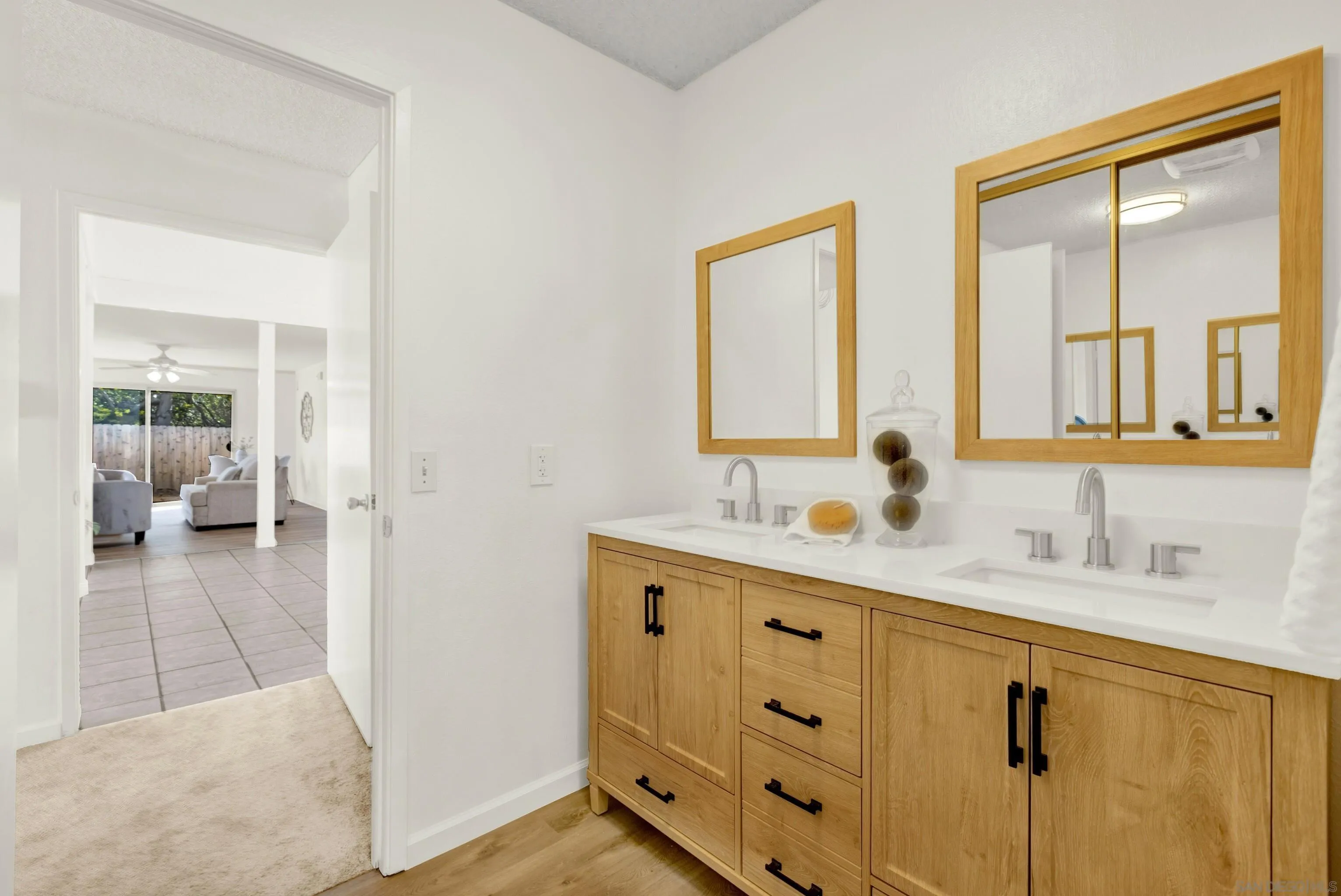 14545 Hillndale Way Poway, CA 92064 - Photo 30 of 52 a bathroom with a double vanity sink mirror and next to a window