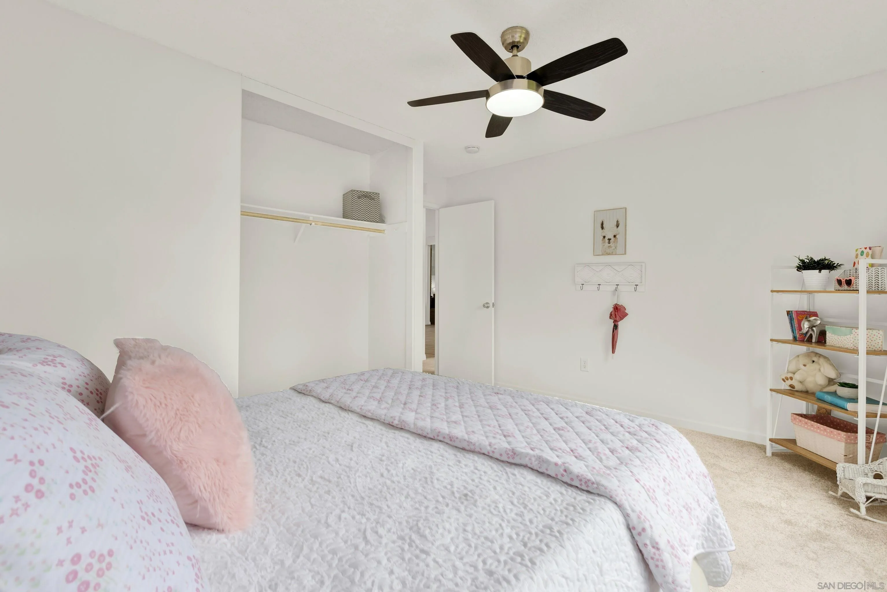 14545 Hillndale Way Poway, CA 92064 - Photo 39 of 52 a bedroom with a bed and a chandelier