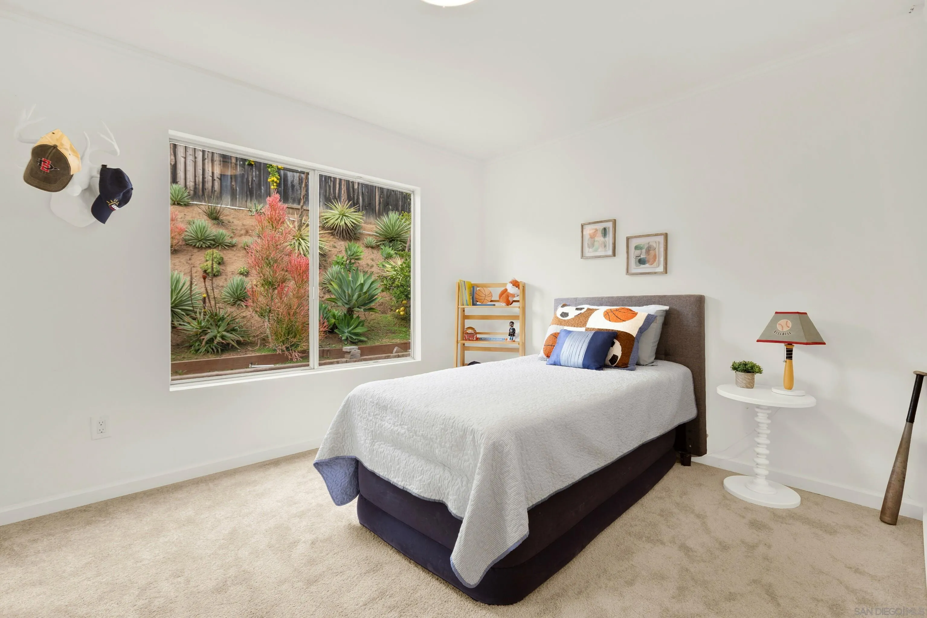 14545 Hillndale Way Poway, CA 92064 - Photo 41 of 52 a bedroom with a bed lamp and a window