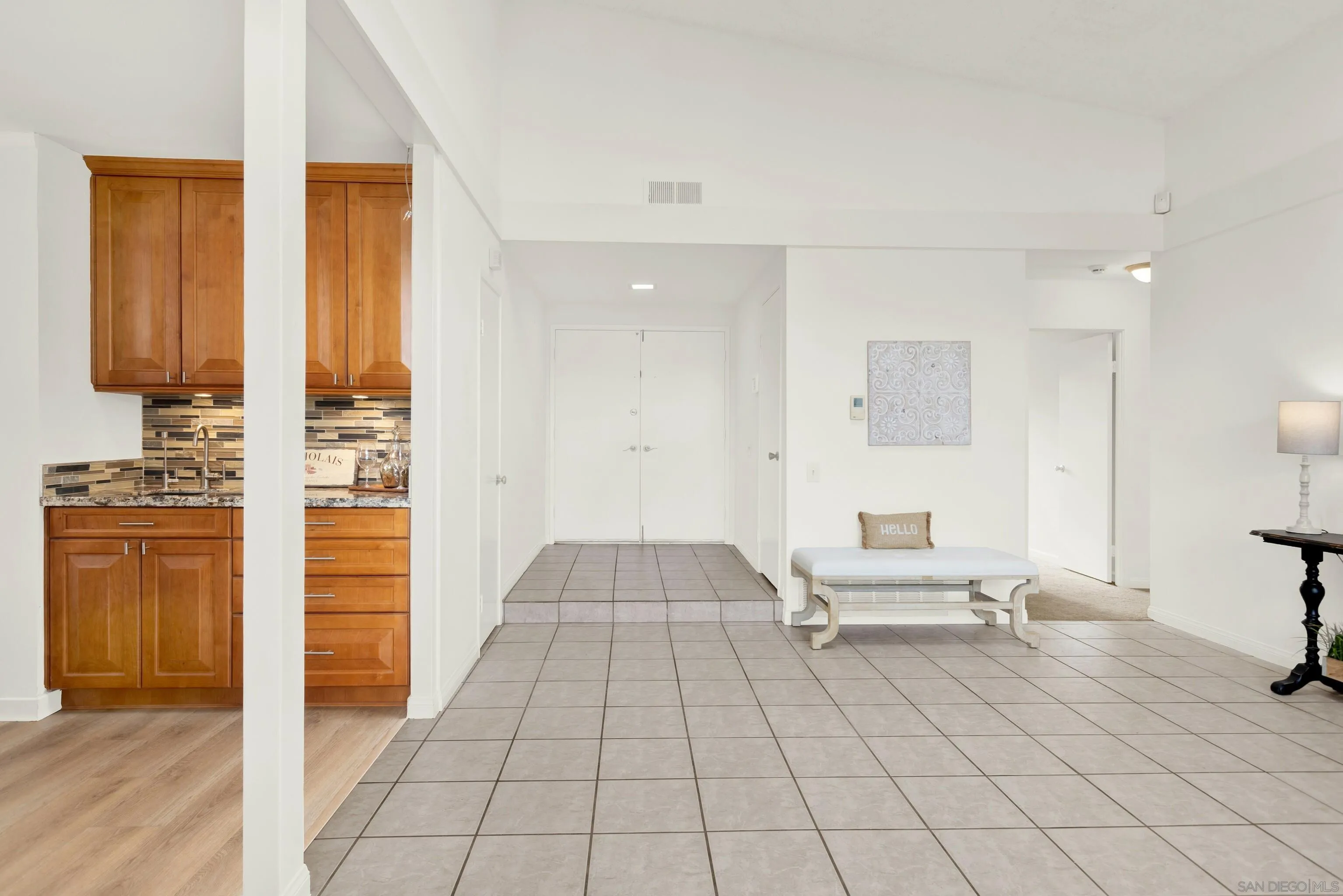 14545 Hillndale Way Poway, CA 92064 - Photo 6 of 52 a living room with furniture and a walk in closet with wooden floor