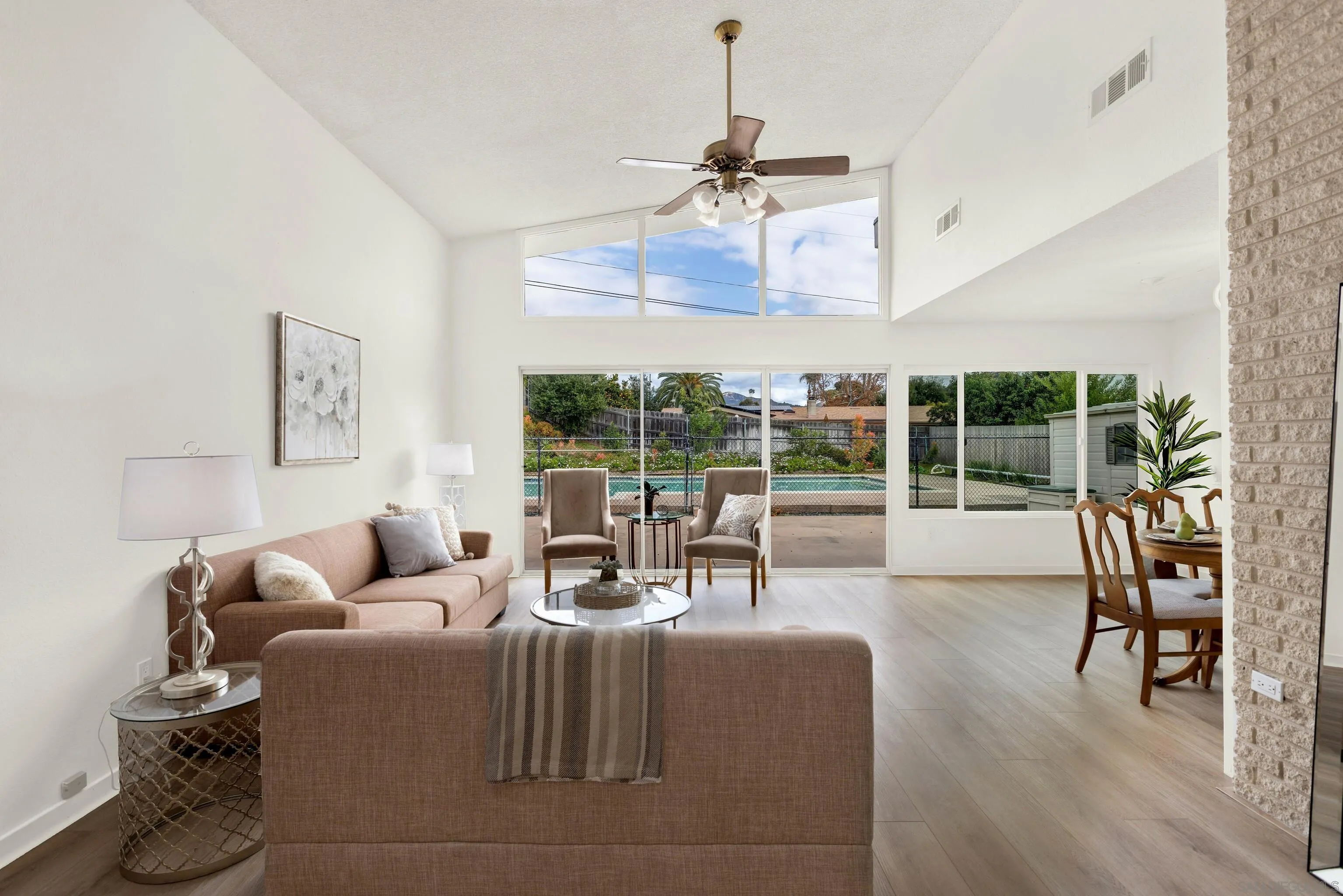14545 Hillndale Way Poway, CA 92064 - Photo 9 of 52 a living room with furniture and a floor to ceiling window