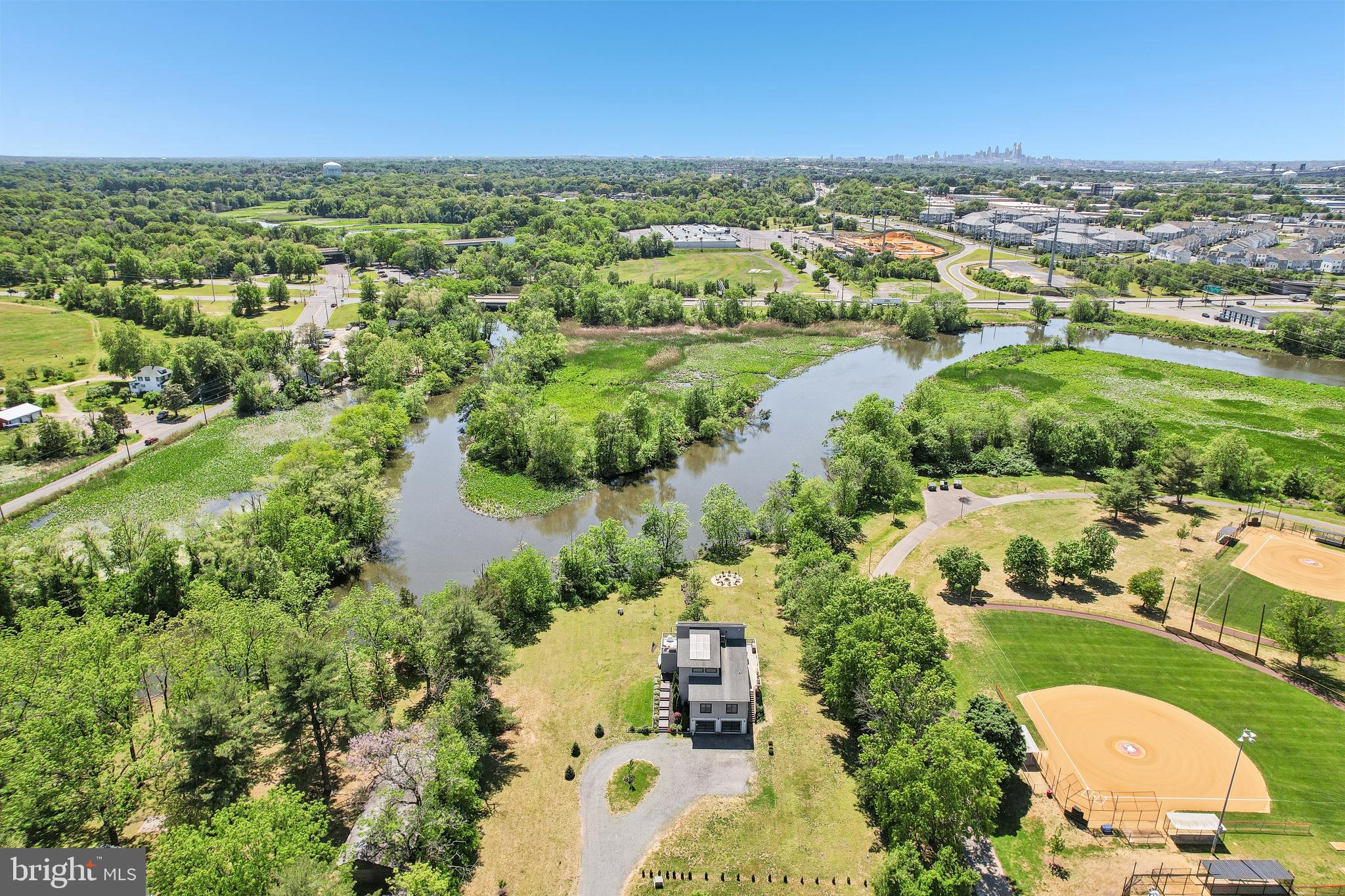 11 Forklanding Road Cinnaminson, NJ 08077 - Photo 57 of 77 an aerial view of residential houses with outdoor space and river