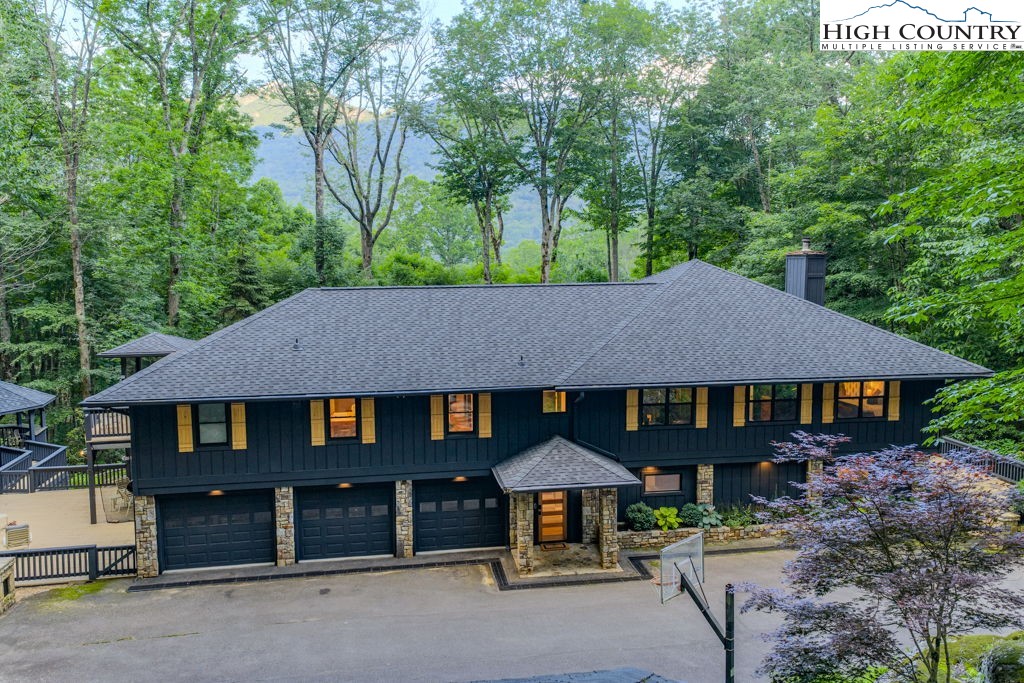 102 Ridge Drive Linville, NC 28646 - Photo 4 of 48 a house with trees in the background