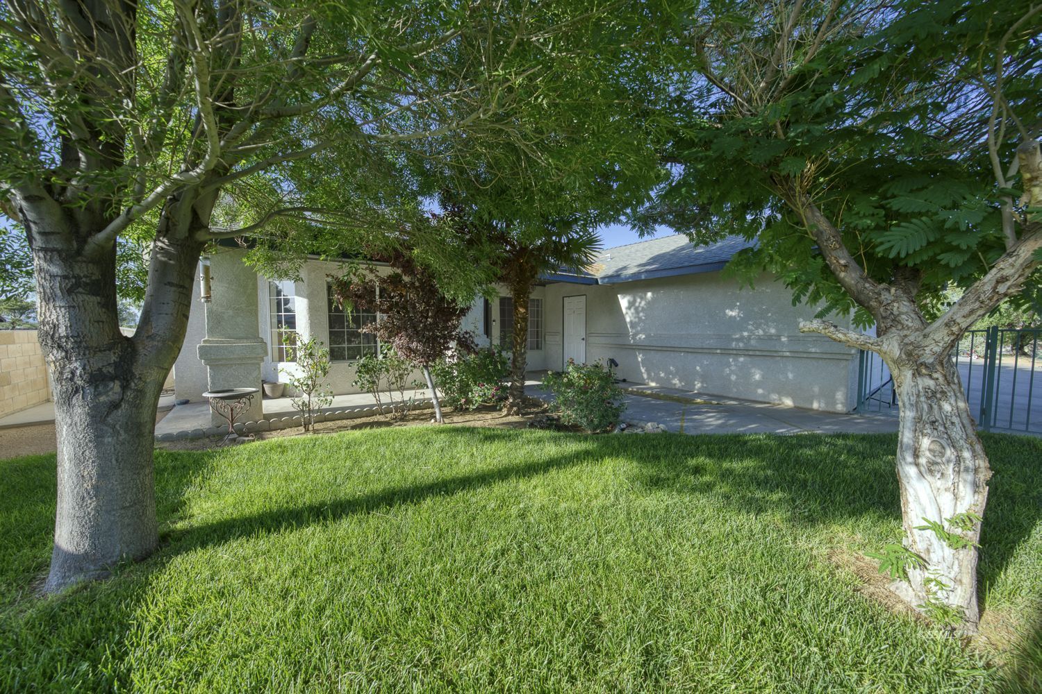 424 Olive Avenue Ridgecrest, CA 93555 - Photo 35 of 46 a front view of a house with a garden