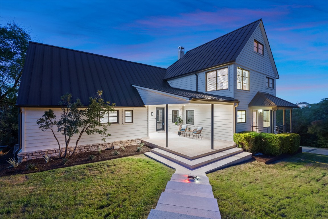 29 Pascal Lane Austin, TX 78746 - Photo 2 of 38 a front view of a house with garden