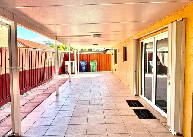 a view of a pathway with a glass door
