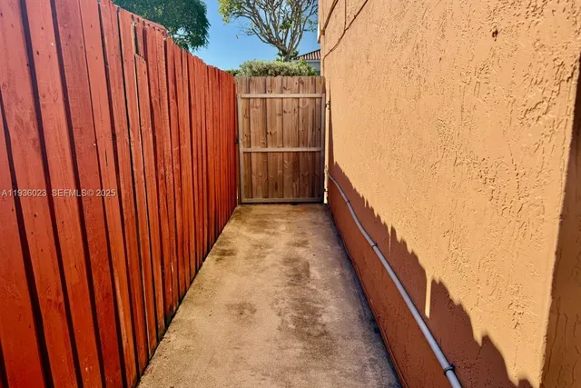 a view of balcony with wooden floor