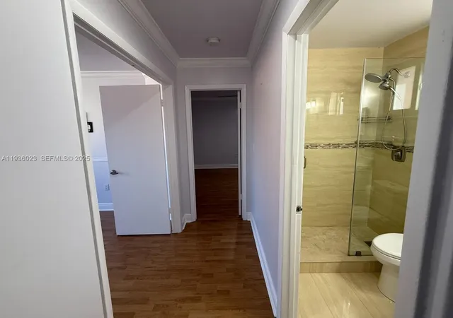 a bathroom with a shower and a toilet