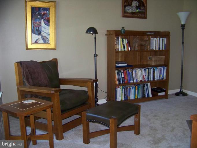 24 Farm Ridge Court Baldwin, MD 21013 - Photo 21 of 30 a living room with furniture a piano and a bookshelf