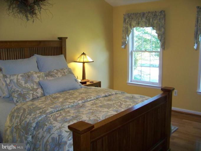 24 Farm Ridge Court Baldwin, MD 21013 - Photo 23 of 30 a bed sitting in a bedroom next to a window