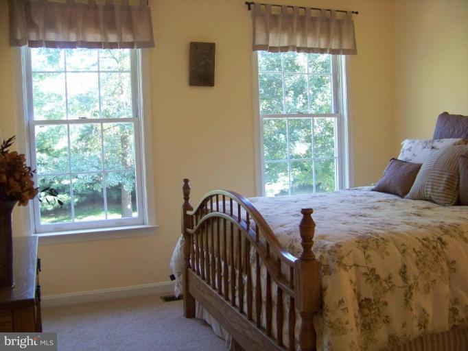 24 Farm Ridge Court Baldwin, MD 21013 - Photo 27 of 30 a bedroom with a bed and a window