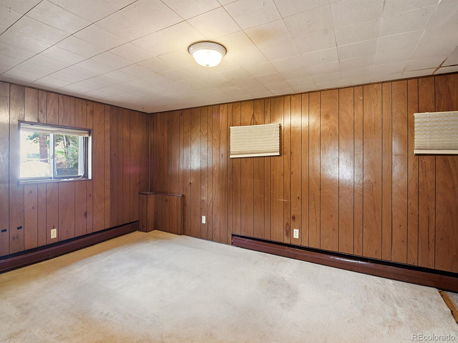 2830 Kerr Gulch Road Evergreen, CO 80439 - Photo 31 of 48 an empty room with windows