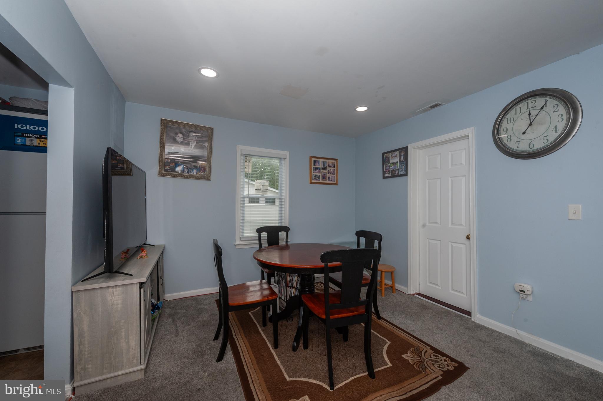 3729 Main Street Grasonville, MD 21638 - Photo 14 of 30 a view of a dining room with furniture and a clock
