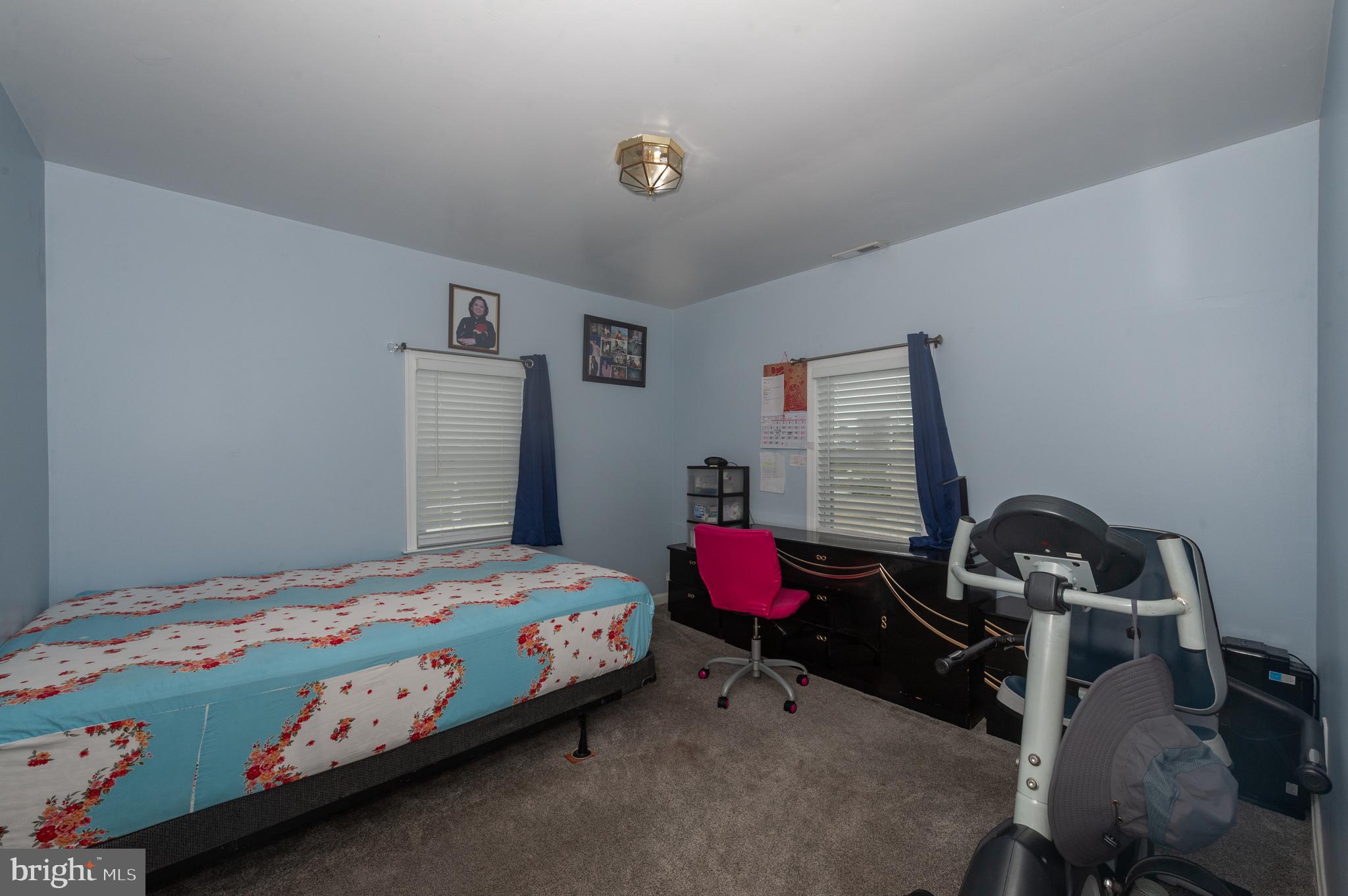 3729 Main Street Grasonville, MD 21638 - Photo 20 of 30 a bedroom with a bed and furniture