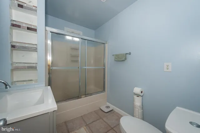 a bathroom with a sink and toilet