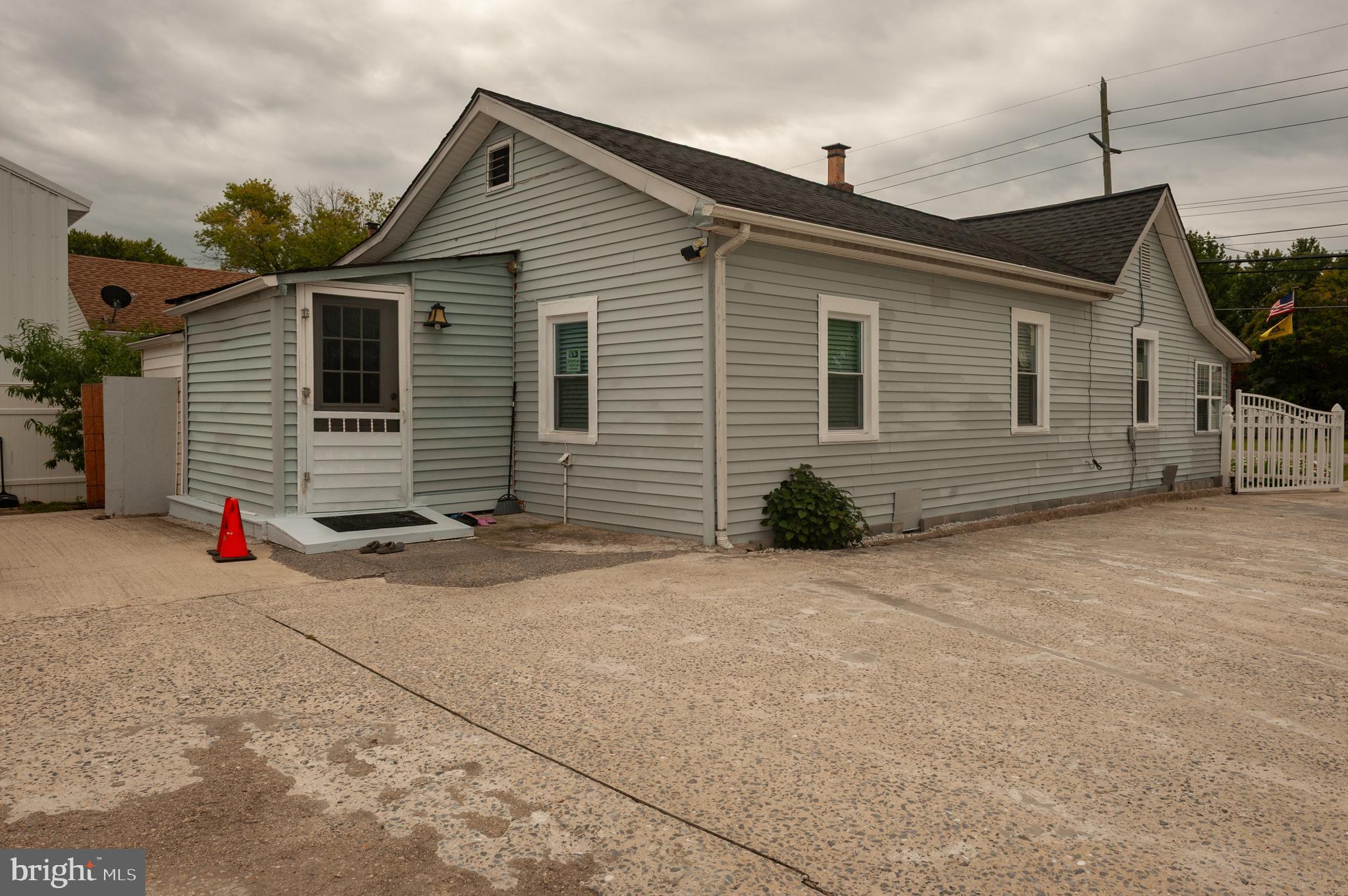 3729 Main Street Grasonville, MD 21638 - Photo 26 of 30 a front view of a house with a garage