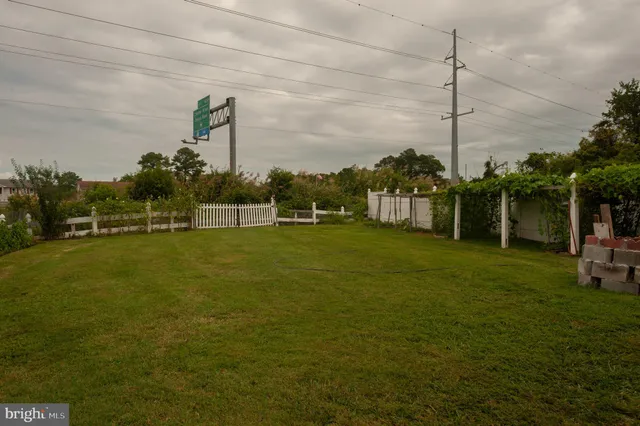 a view of a golf course with chairs