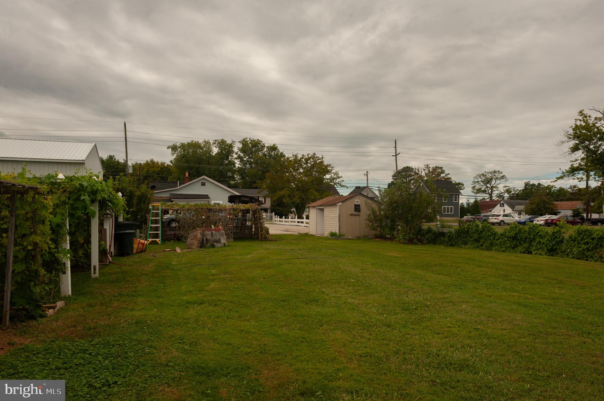 3729 Main Street Grasonville, MD 21638 - Photo 30 of 30 a view of a house with a big yard and large trees