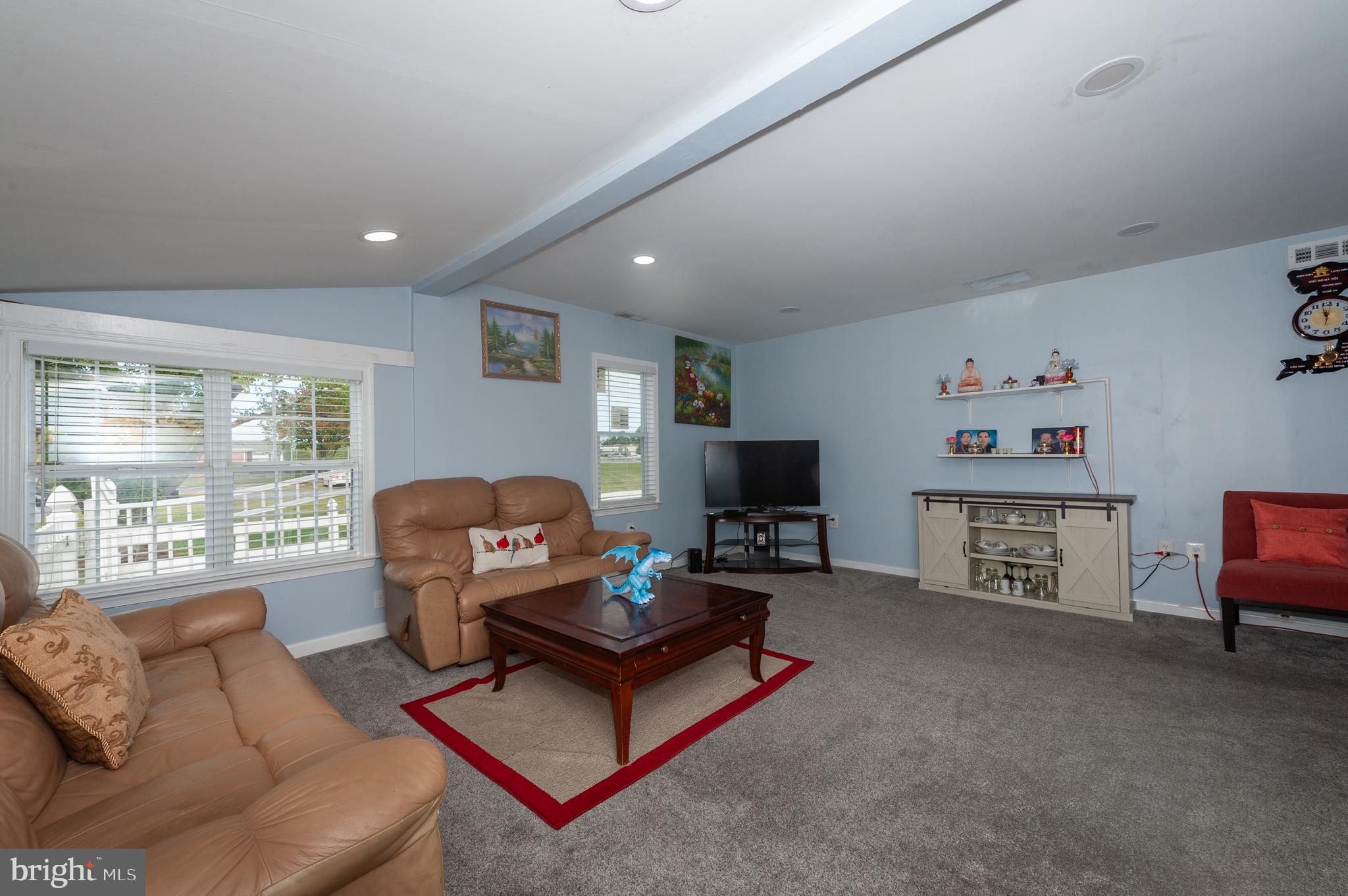 3729 Main Street Grasonville, MD 21638 - Photo 6 of 30 a living room with furniture and a flat screen tv