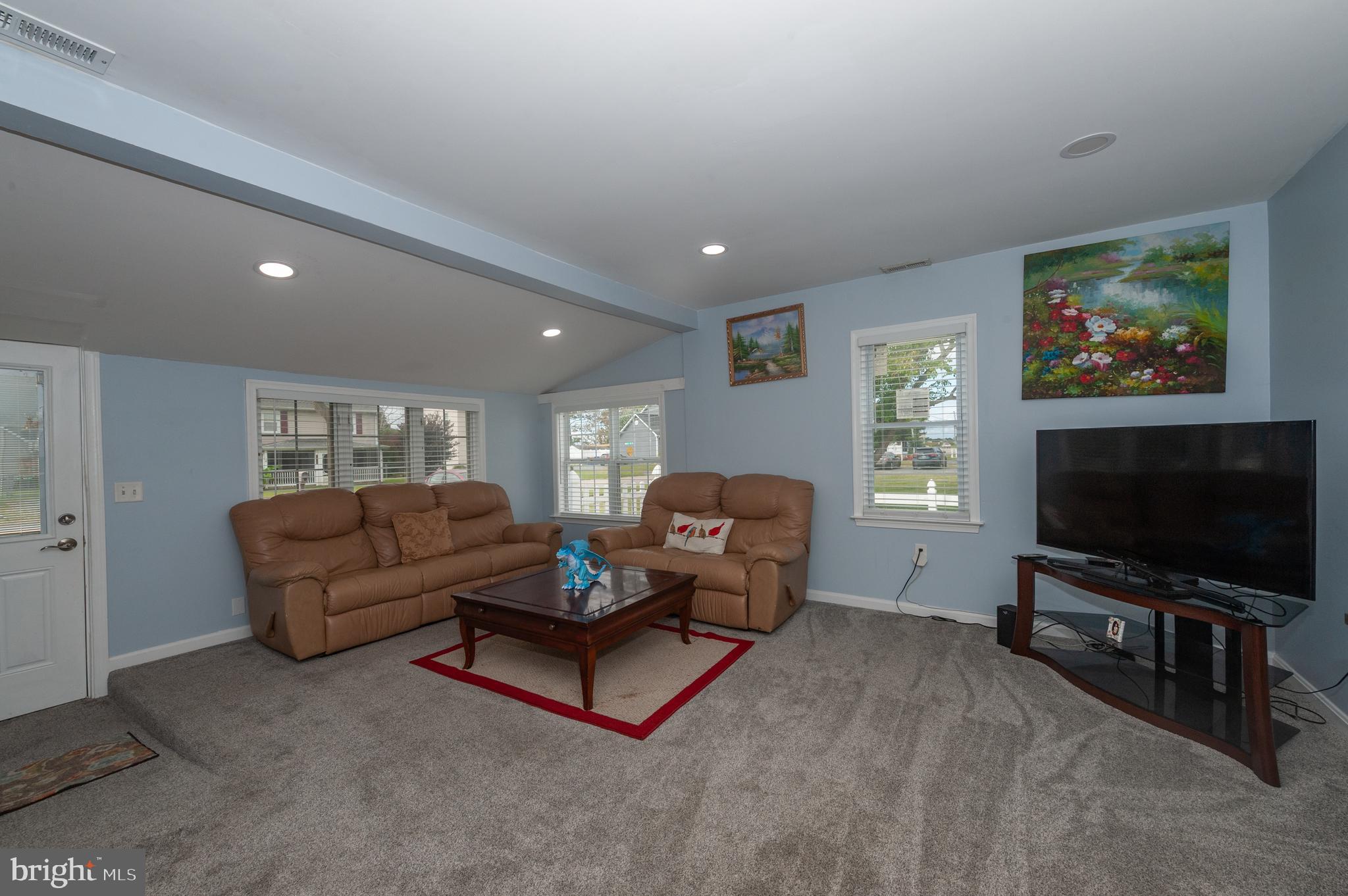 3729 Main Street Grasonville, MD 21638 - Photo 7 of 30 a living room with furniture and a flat screen tv