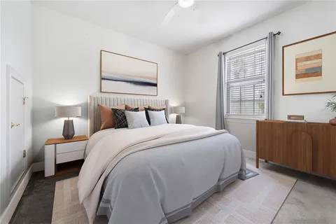 a bedroom with a bed and a couch