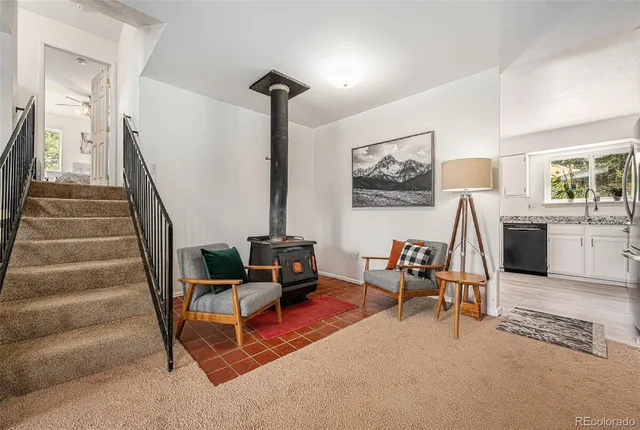 a bathroom with a sink a toilet a mirror a bathtub and next to a window