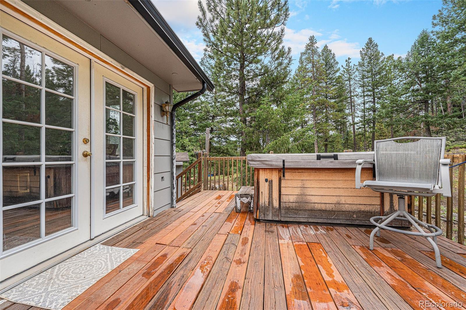 10142 South Turkey Creek Road Conifer, CO 80433 - Photo 26 of 48 a view of a balcony with wooden floor