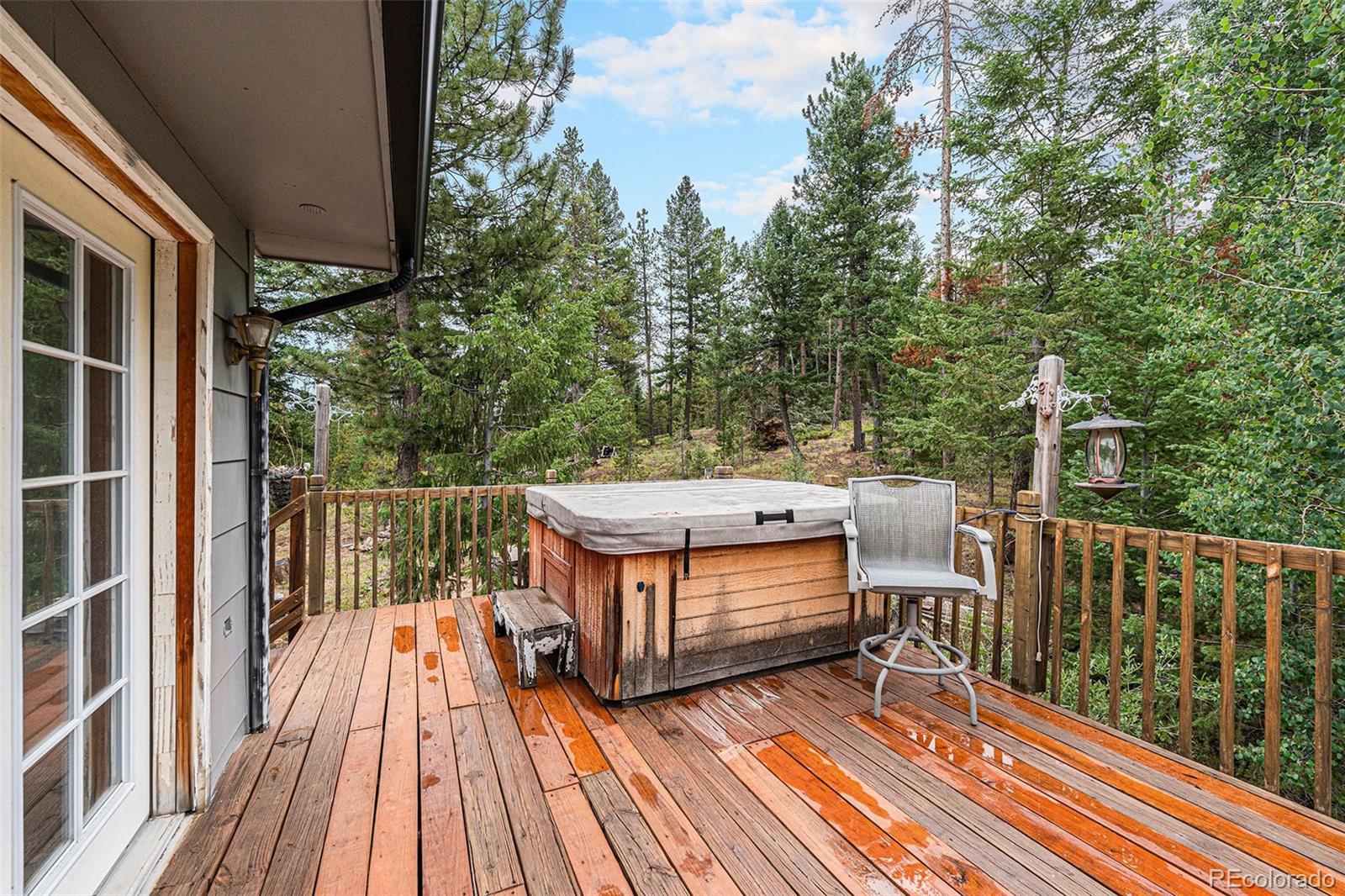 10142 South Turkey Creek Road Conifer, CO 80433 - Photo 28 of 48 a view of balcony with wooden floor and outdoor seating