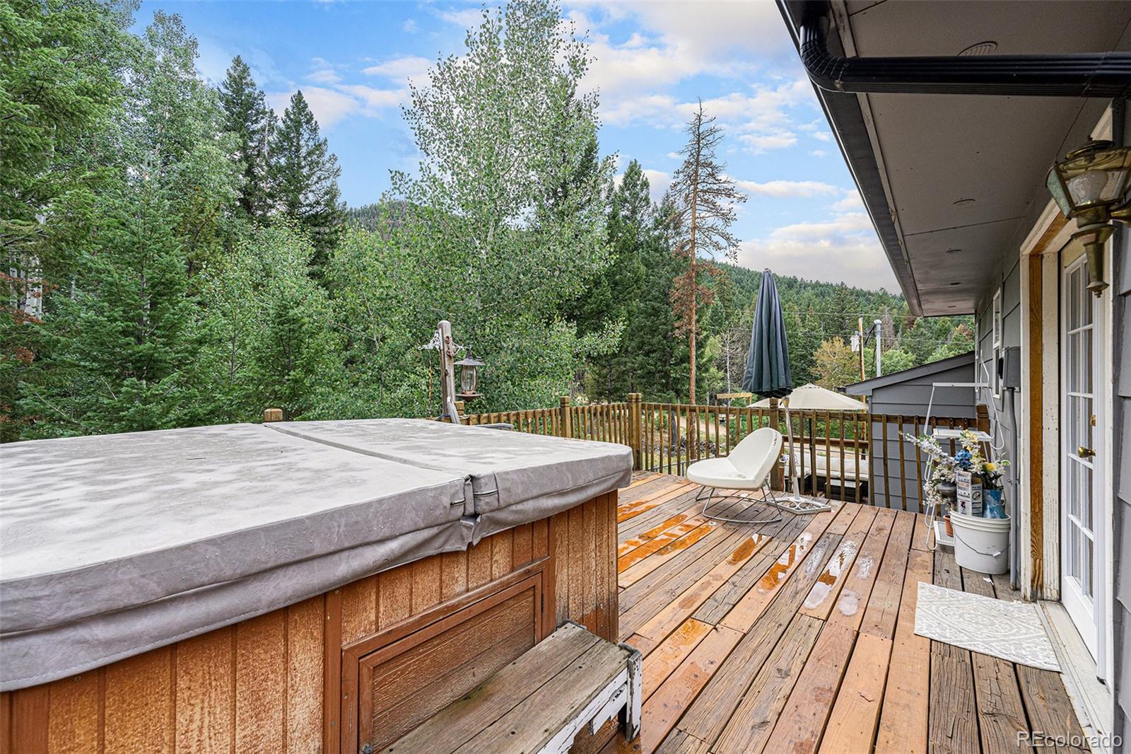 10142 South Turkey Creek Road Conifer, CO 80433 - Photo 29 of 48 a view of balcony with wooden floor and outdoor seating