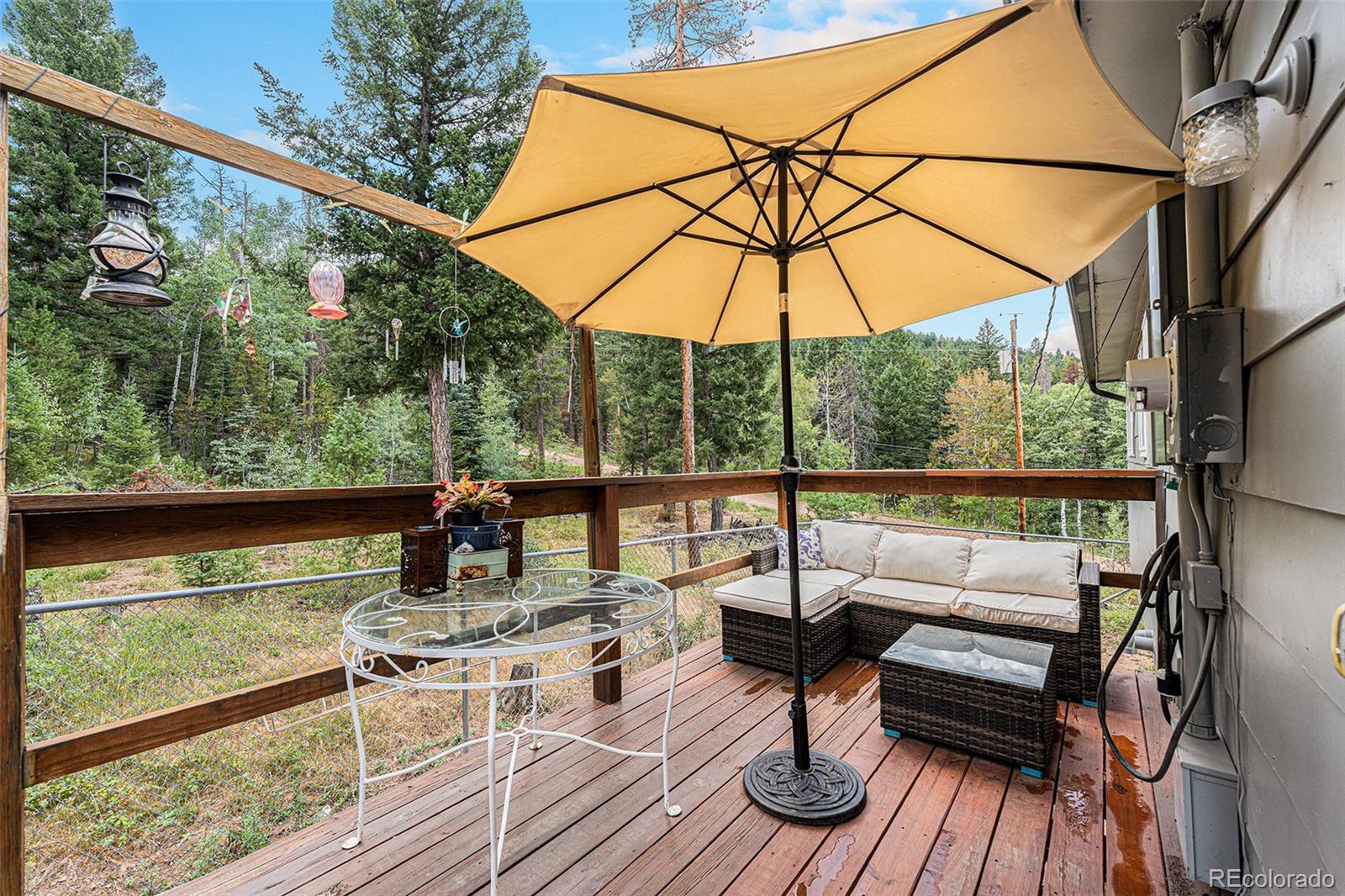 10142 South Turkey Creek Road Conifer, CO 80433 - Photo 30 of 48 a view of sitting area with furniture and wooden floor