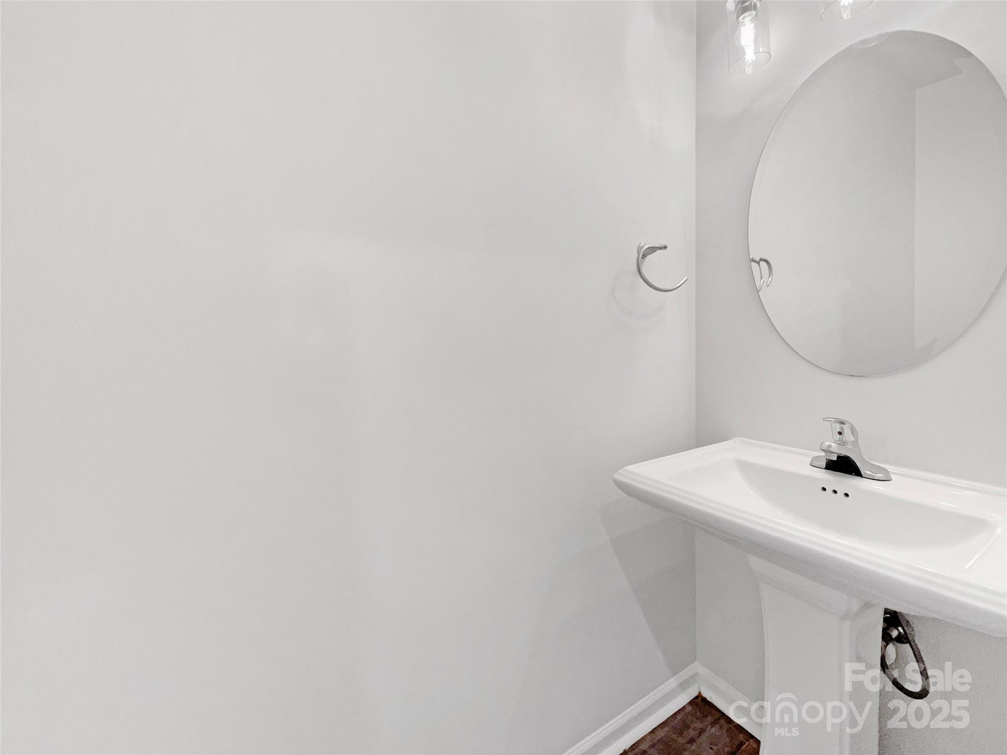 163 Scanlon Road Mooresville, NC 28115 - Photo 12 of 18 a bathroom with a sink and mirror