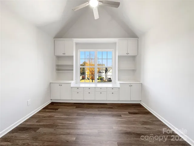 a view of kitchen and wooden floor