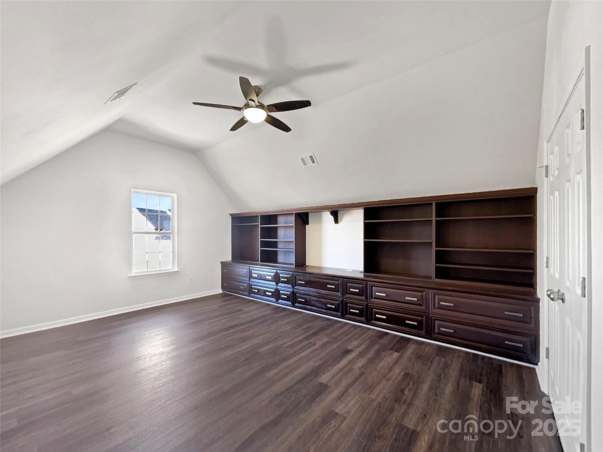 163 Scanlon Road Mooresville, NC 28115 - Photo 15 of 18 a view of room with wooden floor and ceiling fan