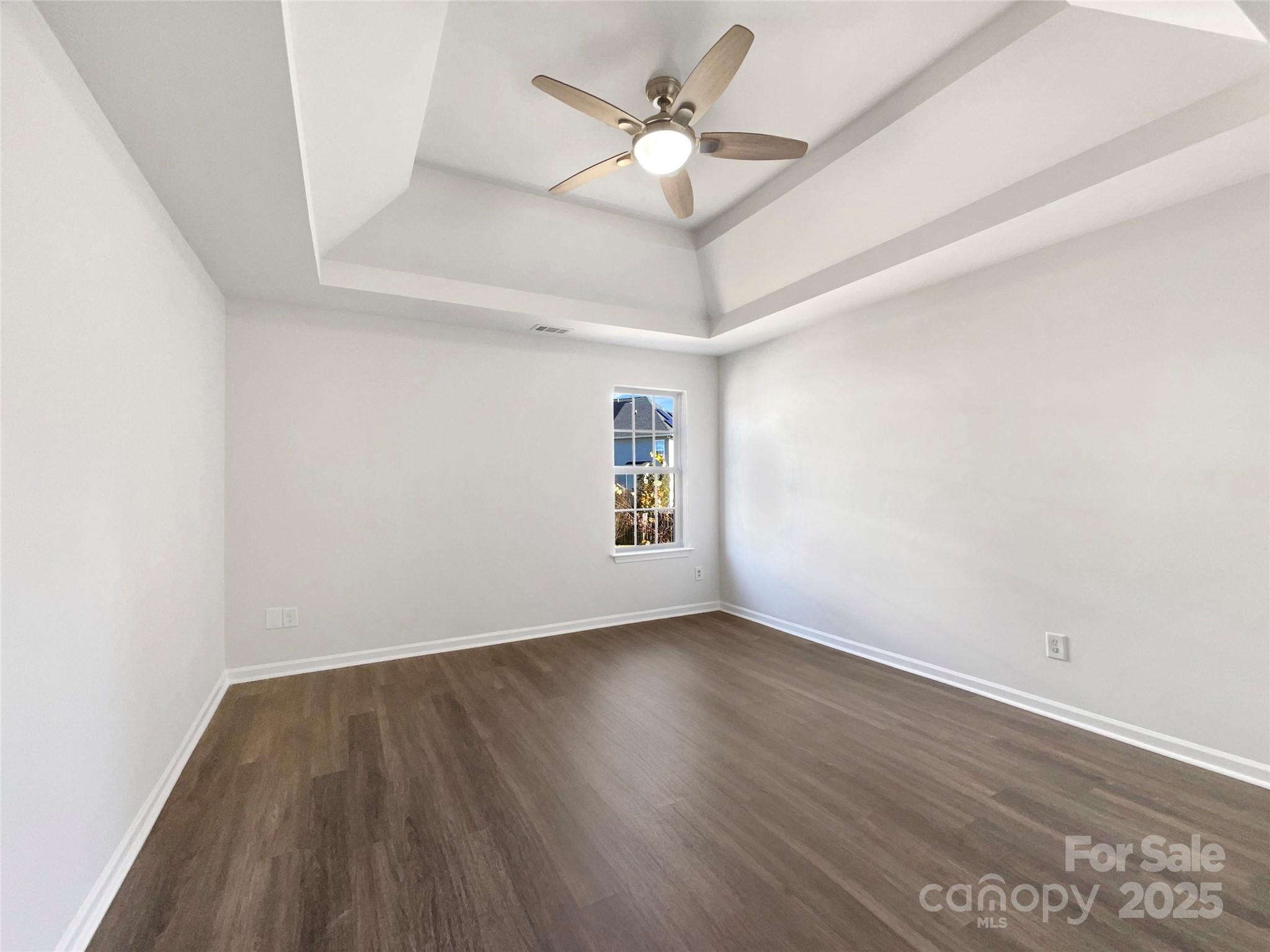 163 Scanlon Road Mooresville, NC 28115 - Photo 16 of 18 an empty room with wooden floor and windows