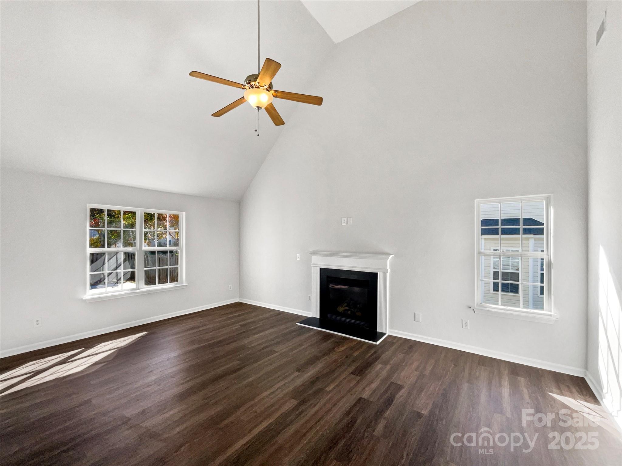 163 Scanlon Road Mooresville, NC 28115 - Photo 3 of 18 a view of empty room with wooden floor and fan