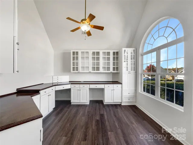 a kitchen with a stove a sink and a refrigerator