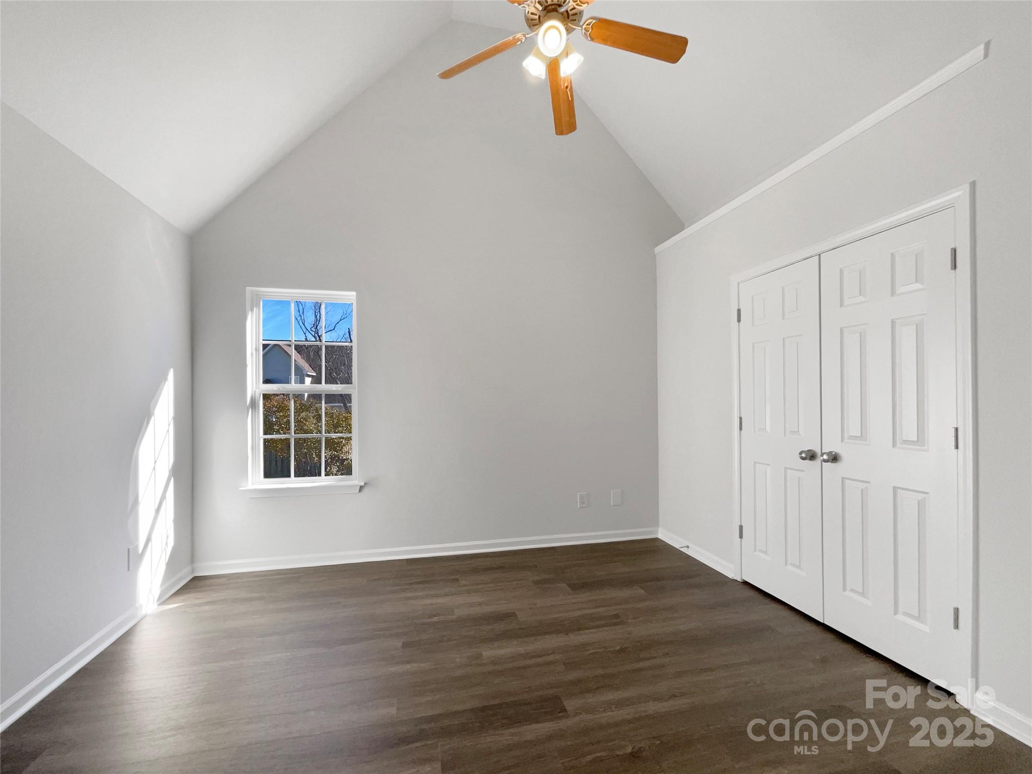163 Scanlon Road Mooresville, NC 28115 - Photo 7 of 18 a view of an empty room with wooden floor and a window