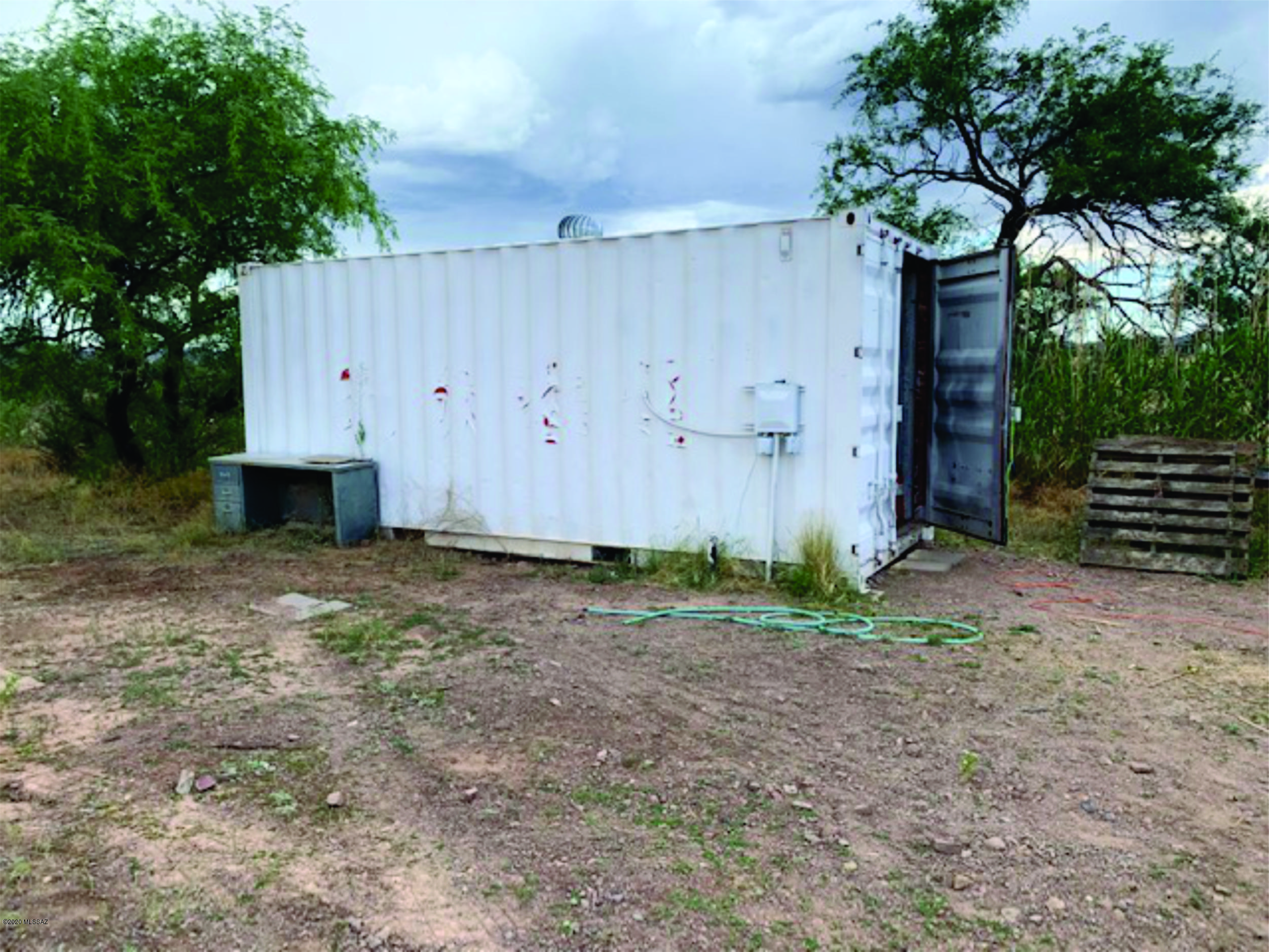 15580 West Hardscrabble Road Arivaca, AZ 85601 - Photo 14 of 14 a front view of a house with garden