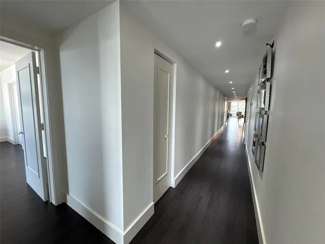 a view of a hallway with the wooden floor