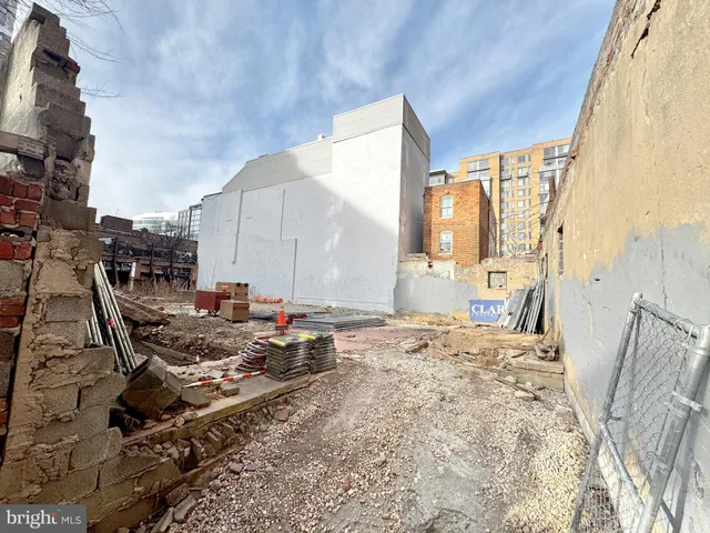 a view of a backyard with sitting area
