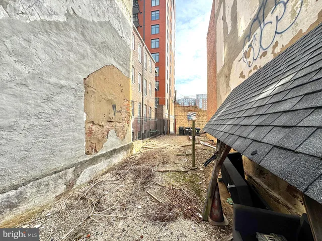 a view of a brick house with many windows