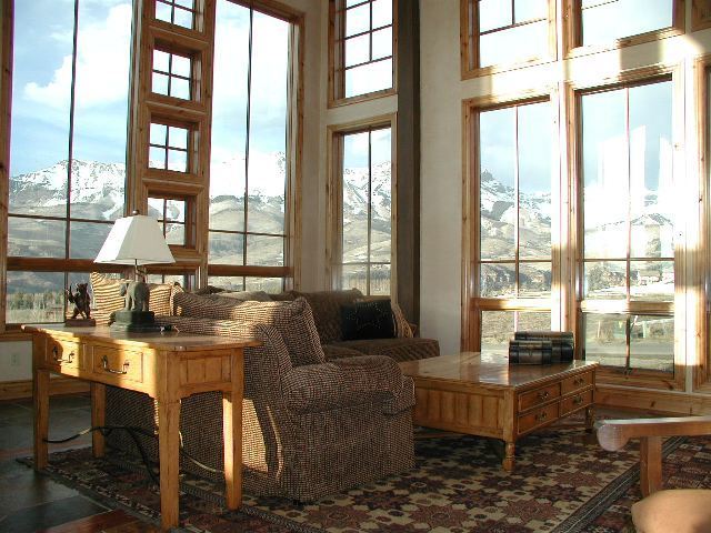 147 Adams Ranch Road Mountain Village, CO 81435 - Photo 3 of 9 a living room with furniture and large windows